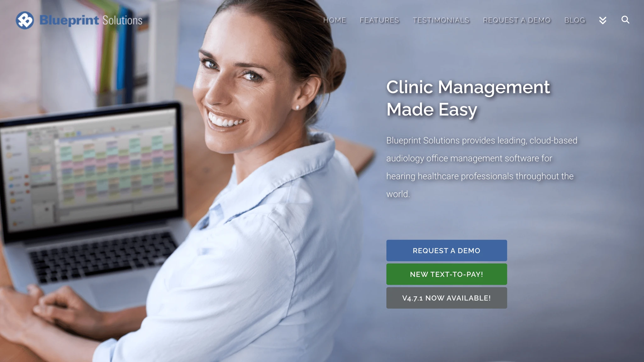 Smiling woman seated at a desk with a computer in the background and text promoting Blueprint Solutions clinic management software.